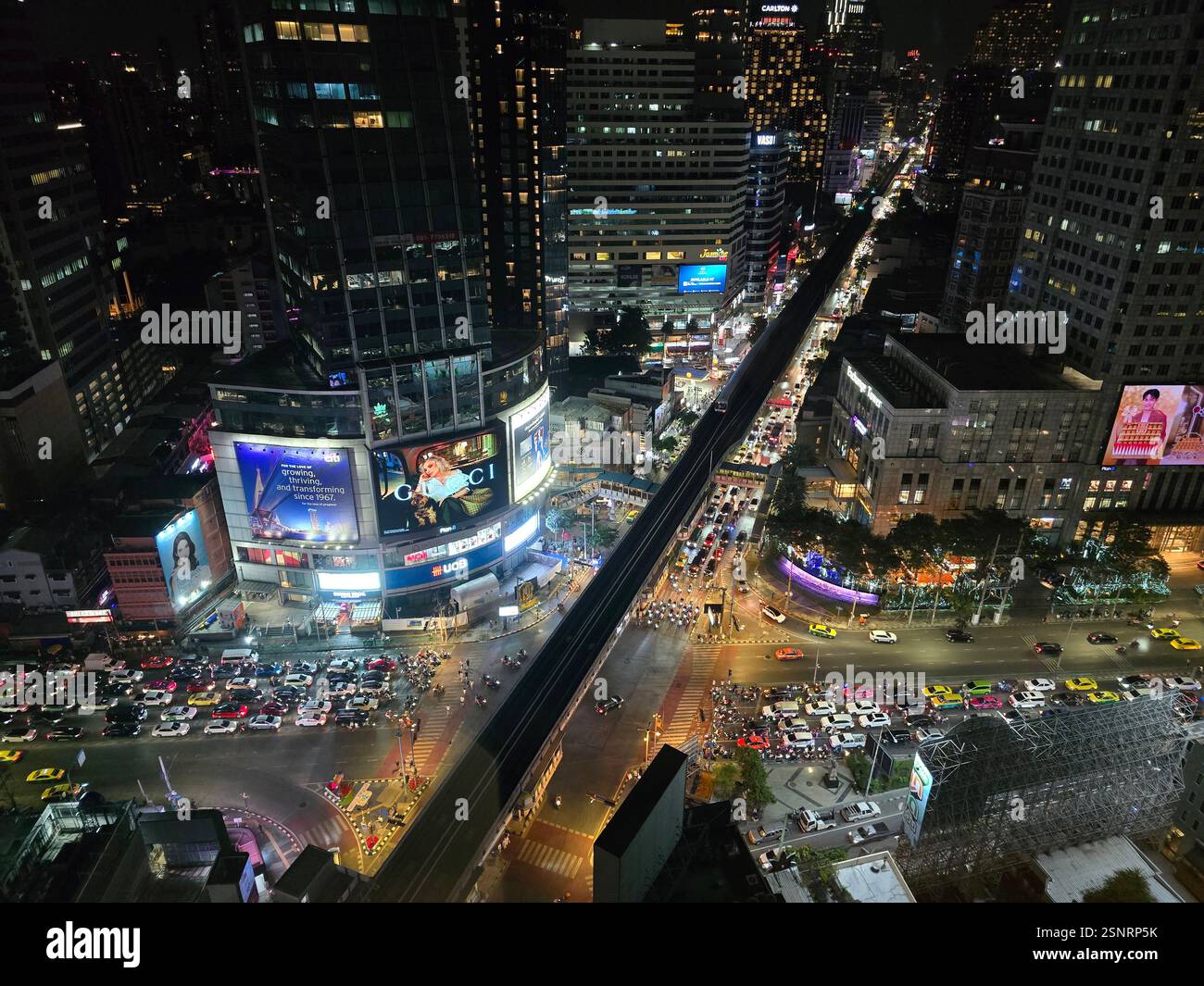 Traffic at Asok junction at night. Bangkok, Thailand. - Smartphone Captured Stock Image