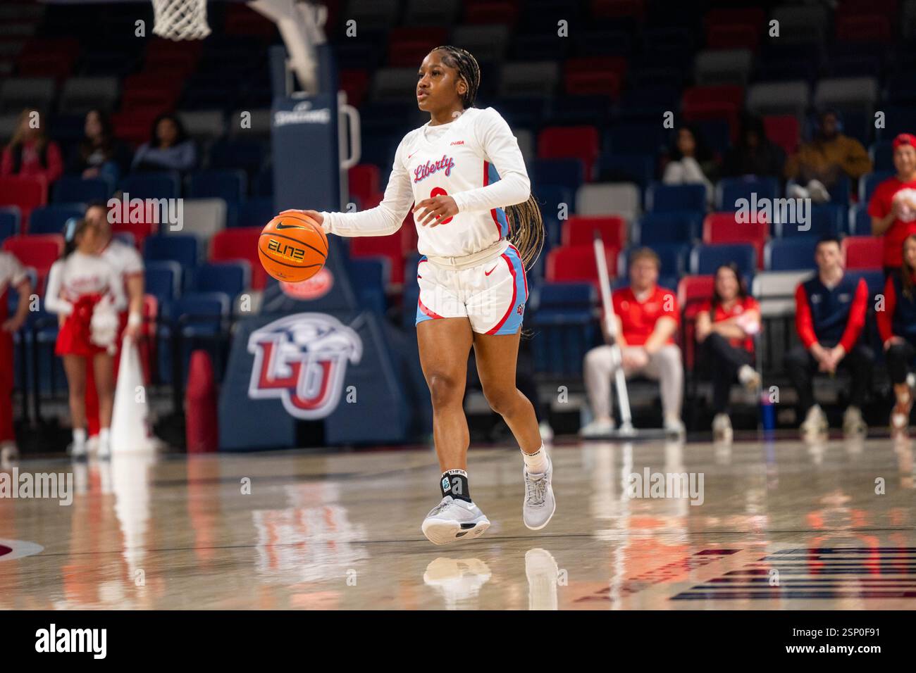 Jordan Hodges #0 of the Liberty Lady Flames dribbles the ball up court