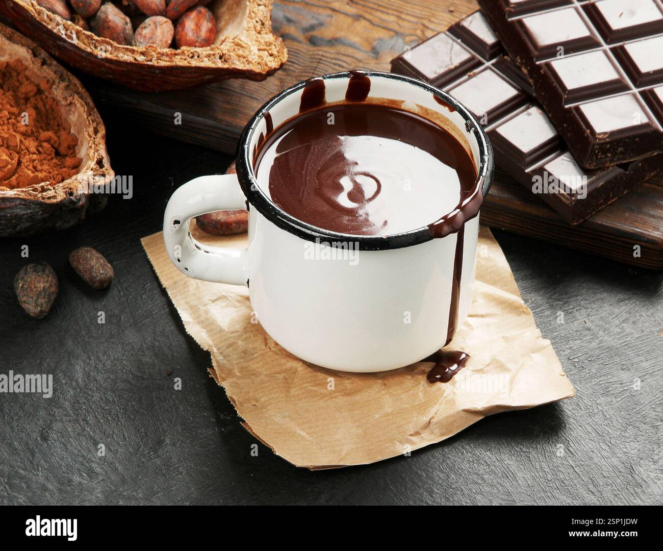 Melted chocolate drink on dark background. Stock Photo