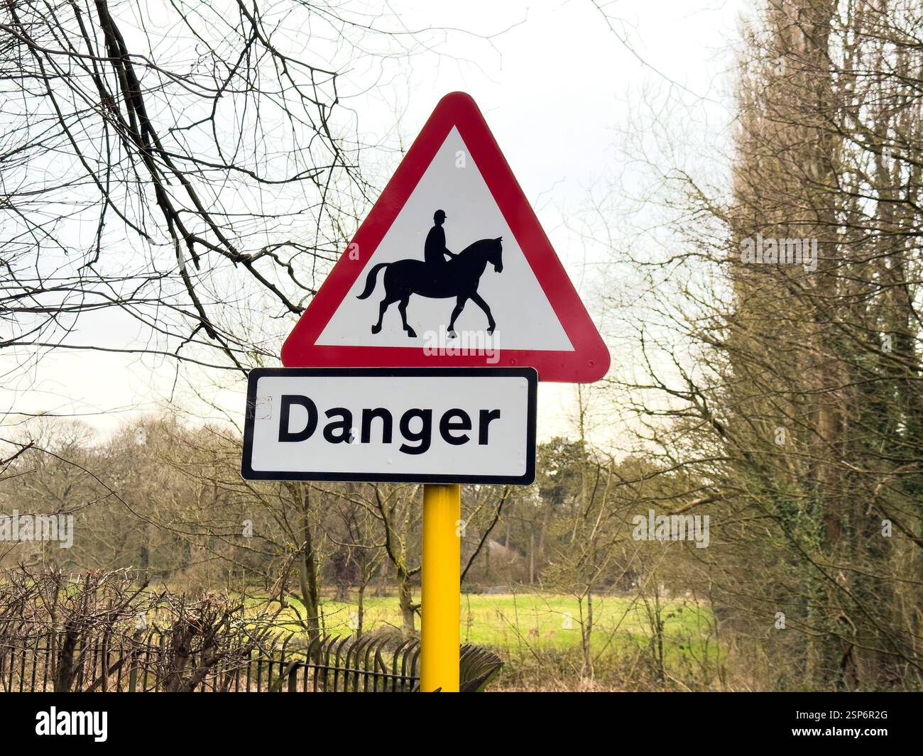 Warning sign traffic road sign of accompanied horses or ponies ahead England UK - Smartphone Captured Stock Image