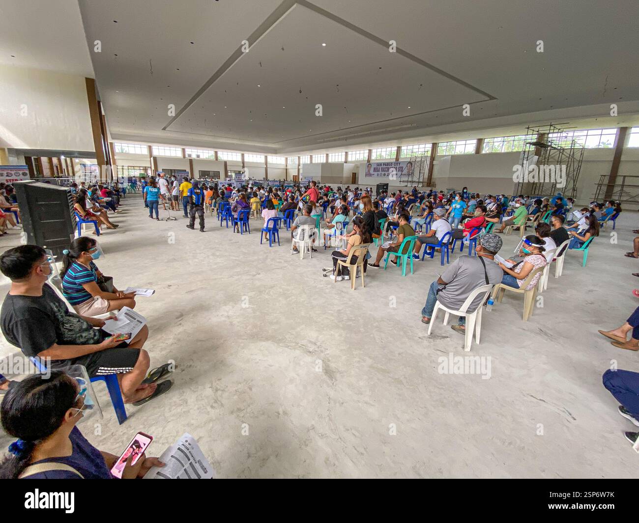 Covid 19 mega vaccination site in a convention center for Filipino National Vaccinations Days, Philippines province, face masks & shields mandatory - Smartphone Captured Stock Image