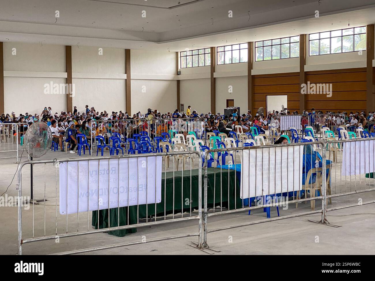 Covid 19 mega vaccination site in a convention center for Filipino National Vaccinations Days, Philippines province, face masks & shields mandatory - Smartphone Captured Stock Image