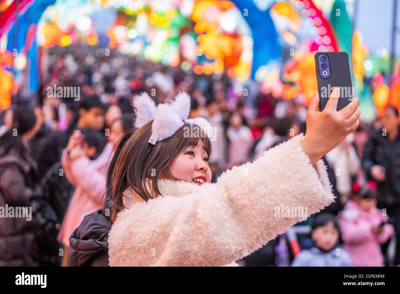 Tourists celebrate the Lantern Festival at the Zigong International ...