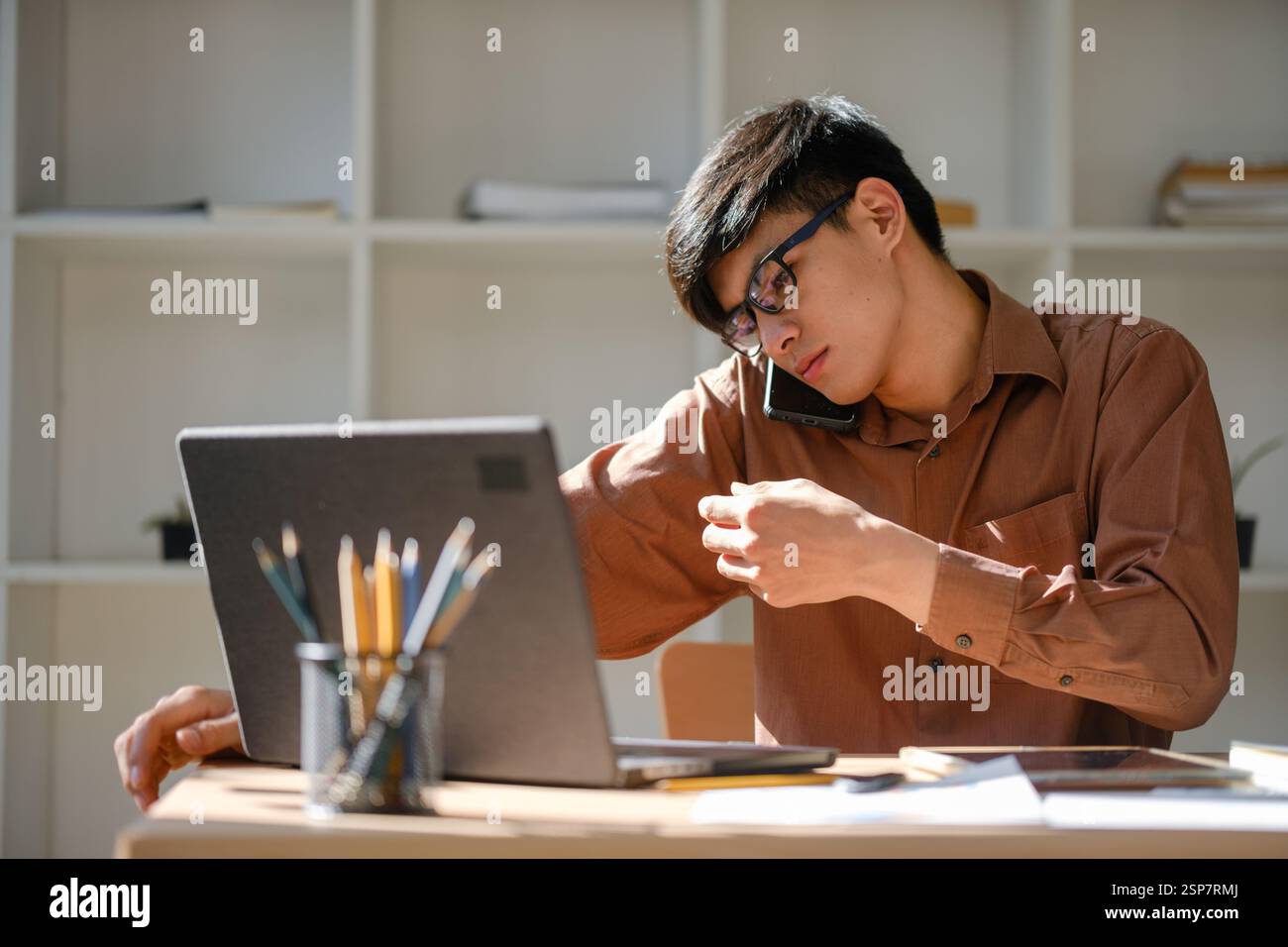 Businessman or student studying online, analyzing financial reports Stock Photo