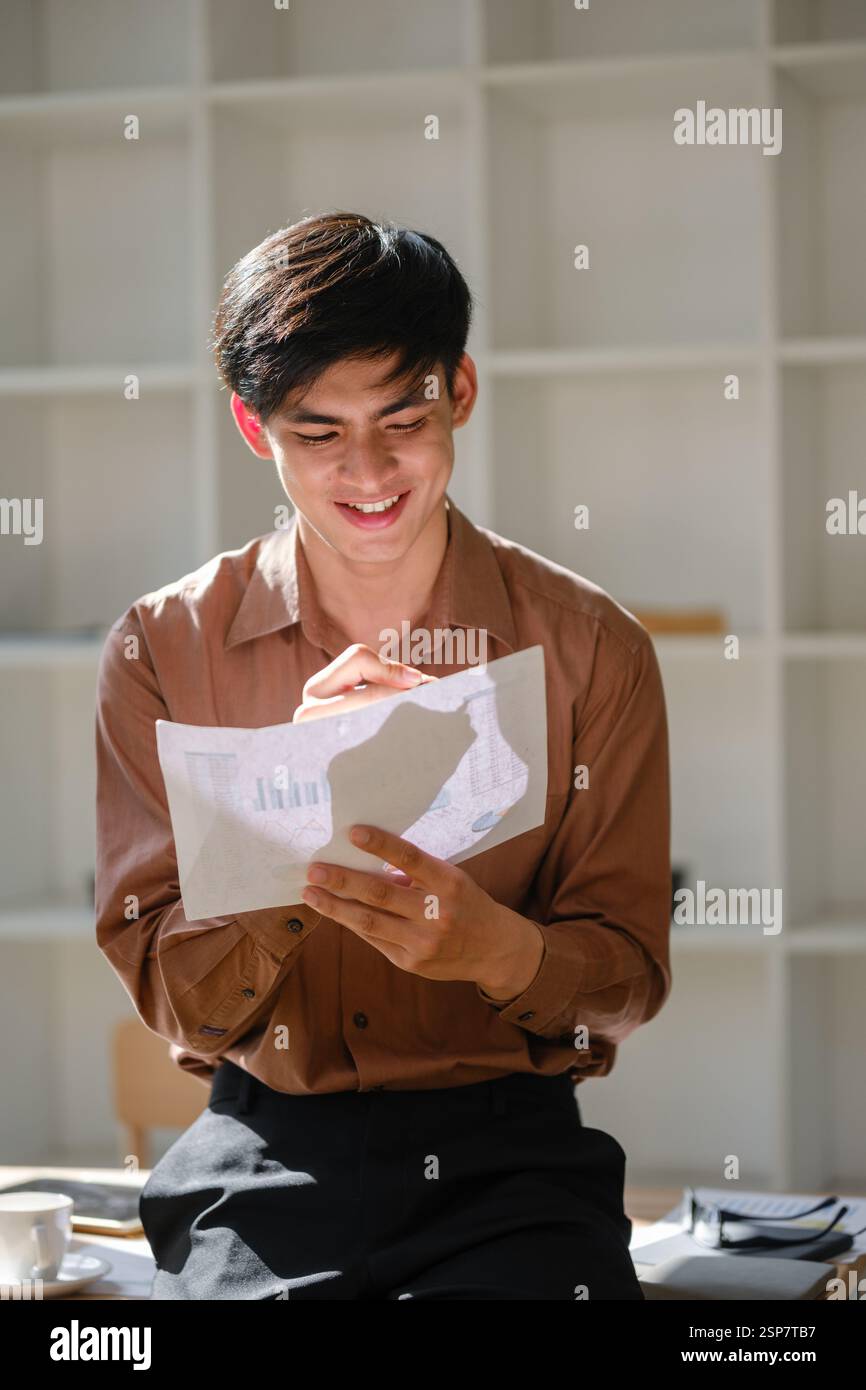 Businessman analyzing financial data and market trends Stock Photo