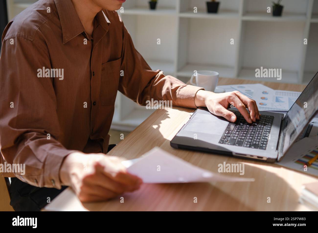 Business professional analyzing financial reports Stock Photo