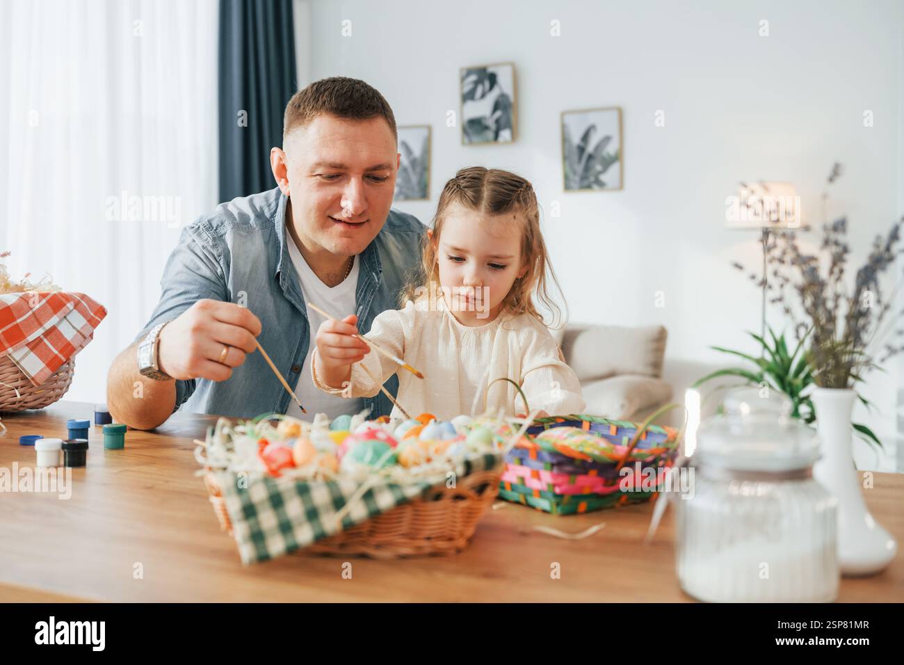 Happy father and daughter celebrating Easter holidays together Stock