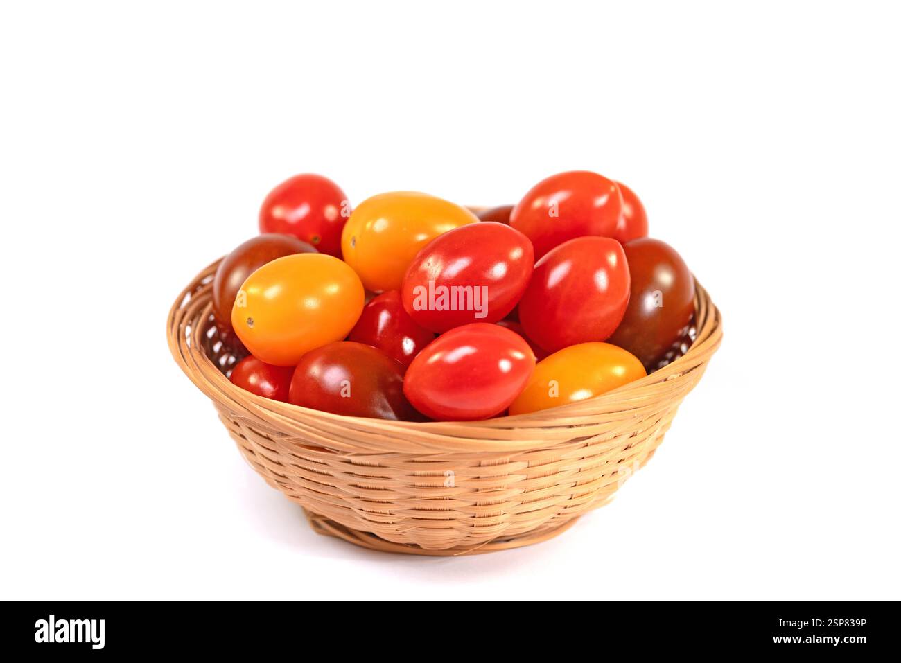 Various mini tomatoes against a white background Stock Photo