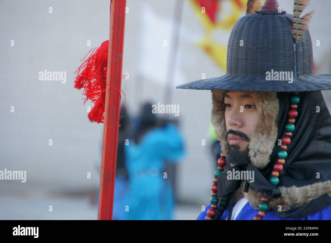 Royal guard South Korea. In vibrant red uniforms and black hats, they stand in formation, showcasing traditional Korean military attire. Their regimen Stock Photo