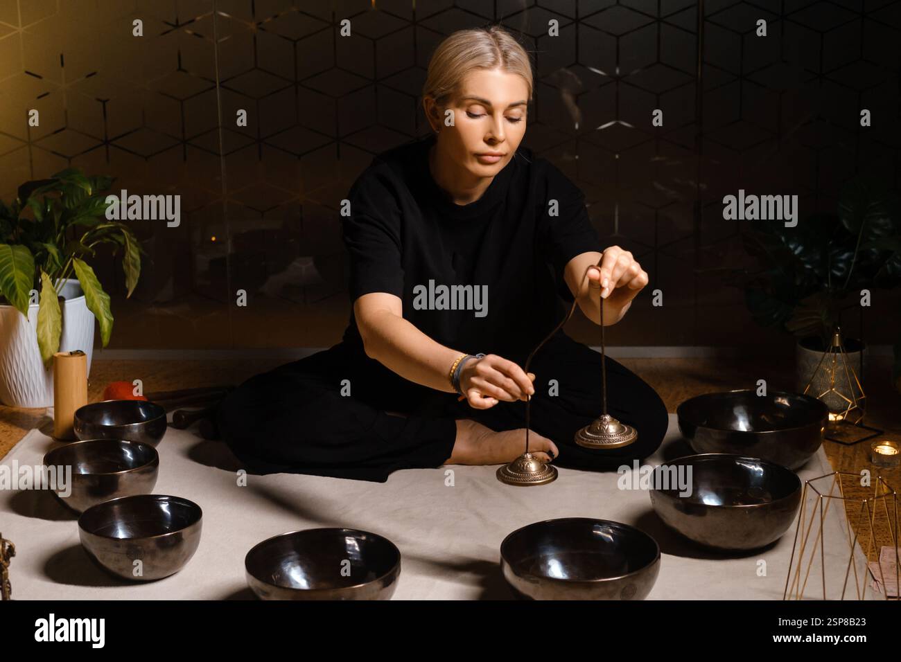 Sound healing session with singing bowls and a practitioner in a calm ...