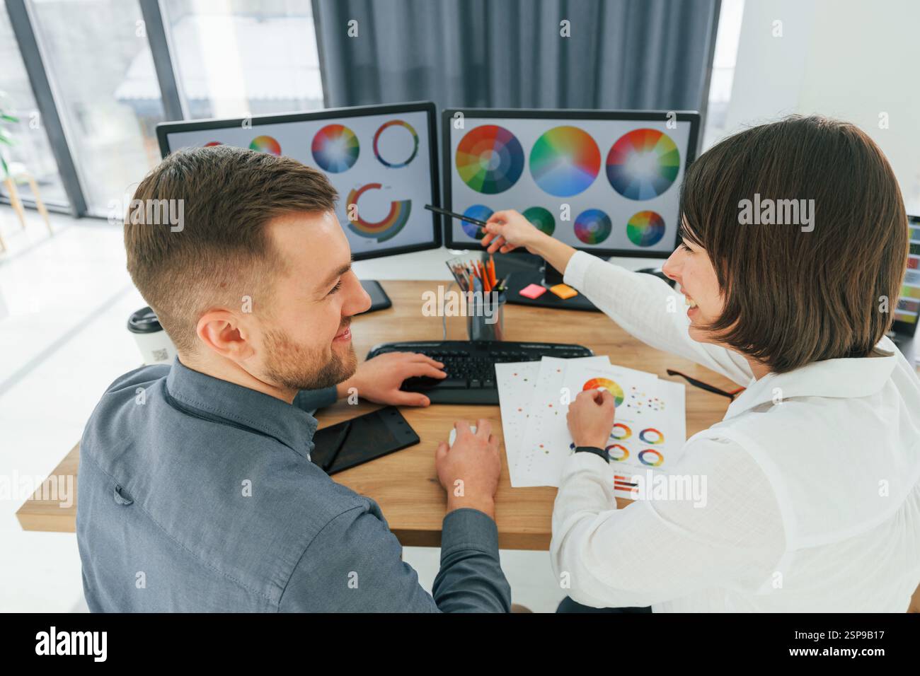 Two designers working together in the office. Stock Photo