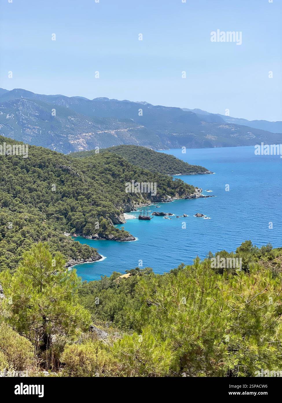 Stunning mountain landscape and the beautiful blue waters of the Mediterranean Sea in a bay - Smartphone Captured Stock Image