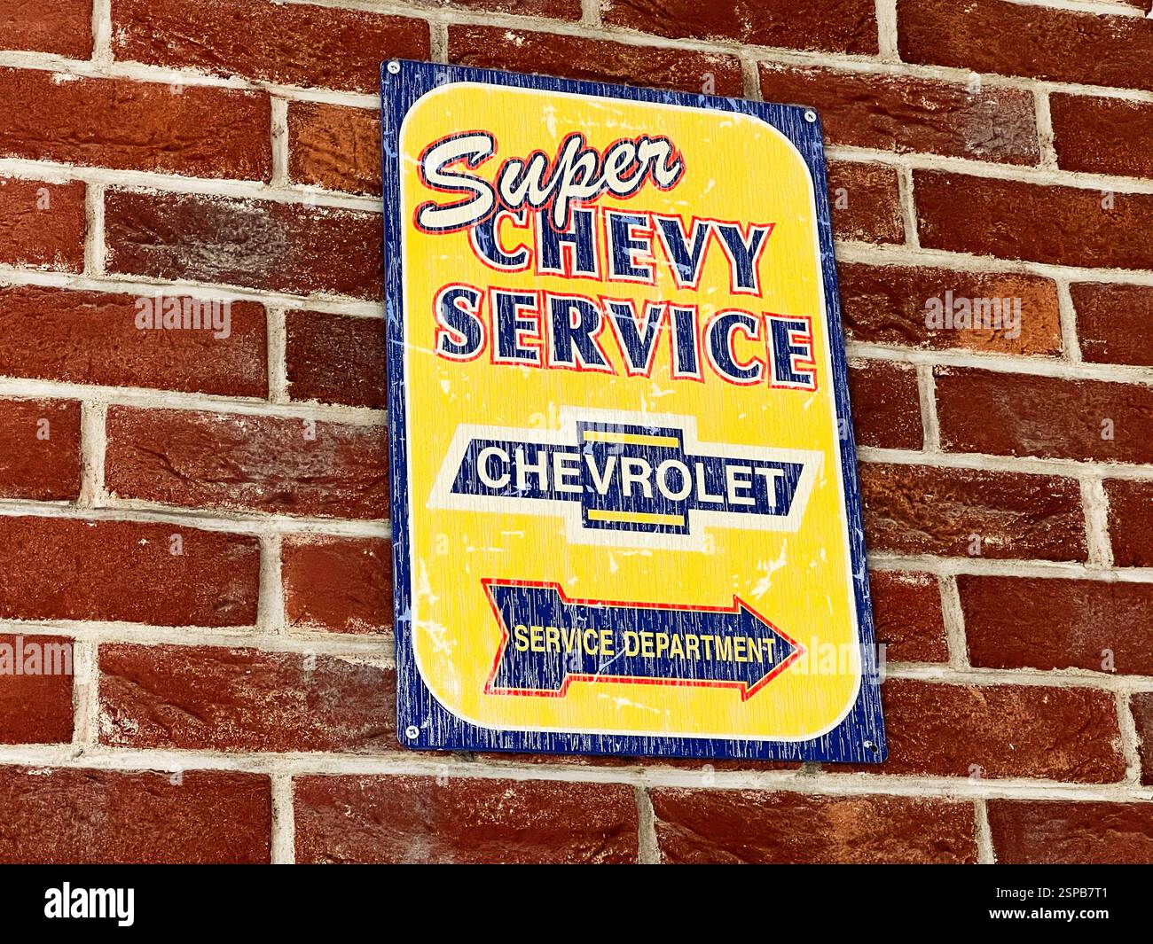 Service Mounted Lviv, Ukraine - February 13, 2025: Retro yellow Chevrolet sign ...