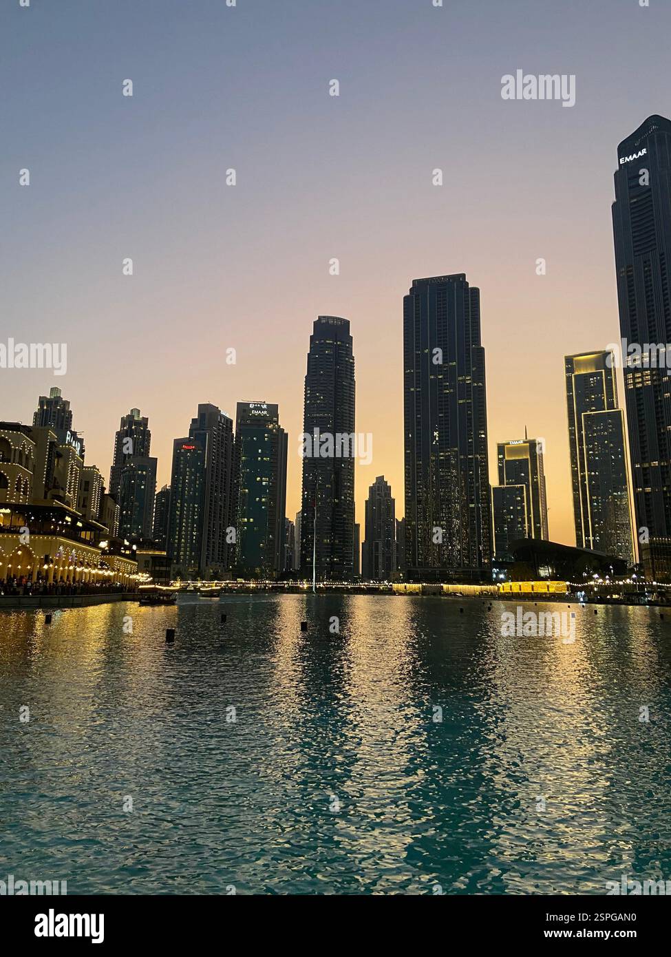 Sunset in downtown Dubai with a nice view on the skyscrapers in front of the Burj Khalifa - Smartphone Captured Stock Image