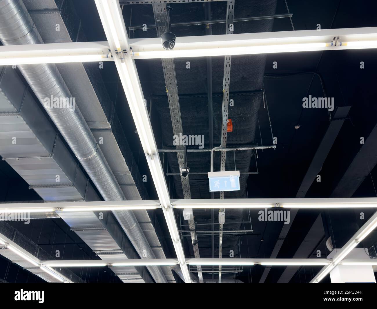 Lights and ventilation system in long line on ceiling of the industrial ...