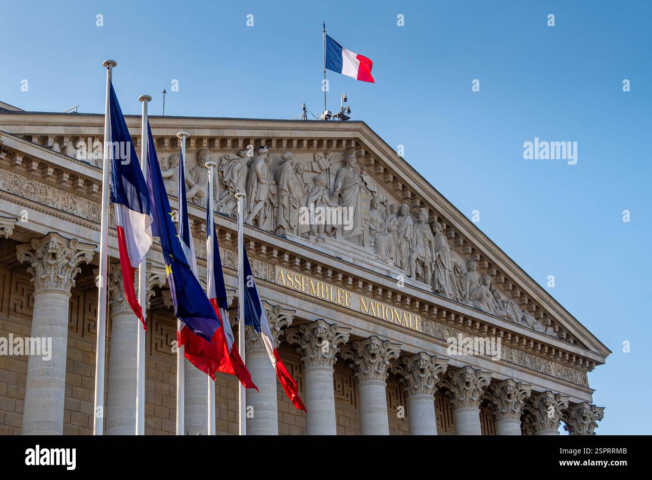 Flags and facade of the National Assembly building (Assemblee Nationale), aka Palais Bourbon or chamber of deputies,Paris, France Stock Photo