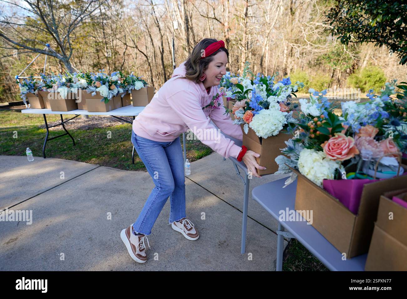 Volunteer and widow Jillian Myers, organizes gift boxes during a