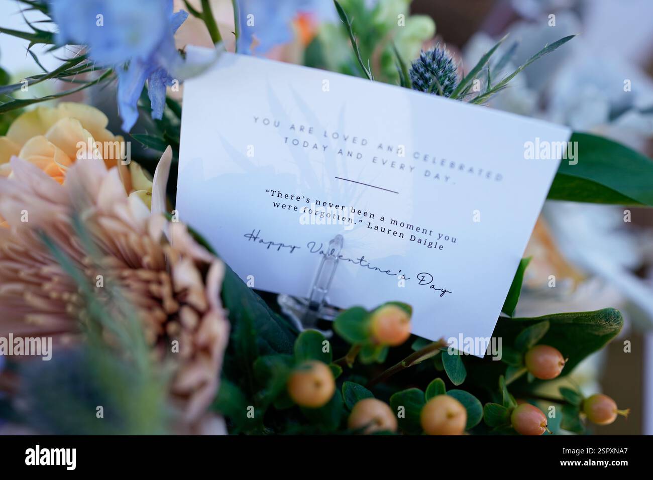A note inside a flower arrangement is seen during a Valentine's Day