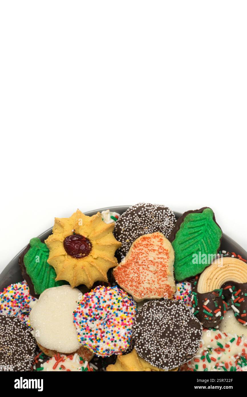 Christmas cookies assorted shortbread partial plate snacks white background copy space. Stock Photo