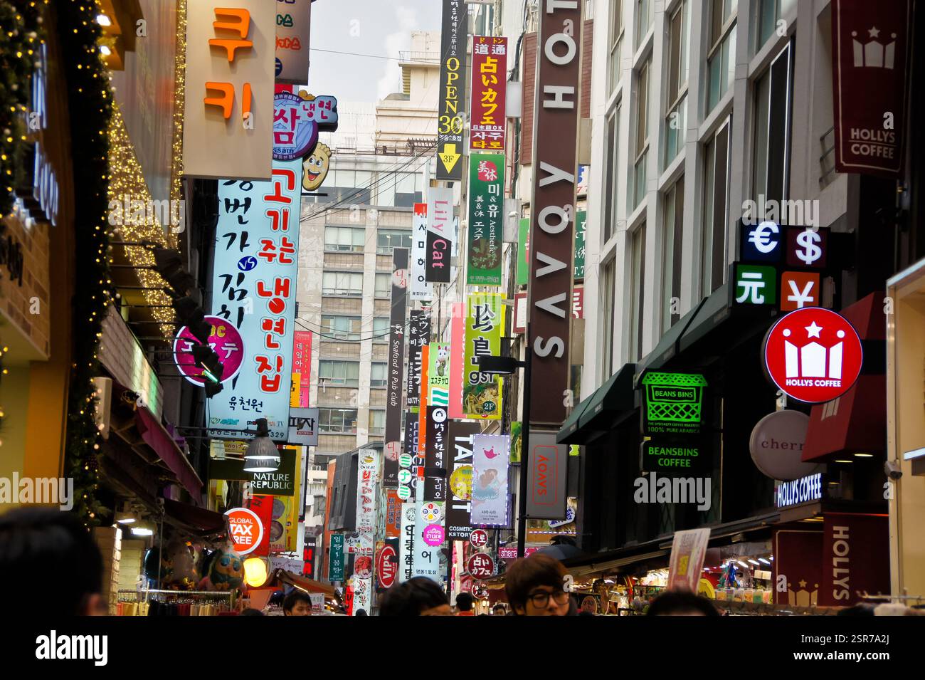 Korean cafe sign with English and Korean text. Open sign. Variety of shops and restaurants nearby. Possible tourist destination in South Korea. Korean Stock Photo