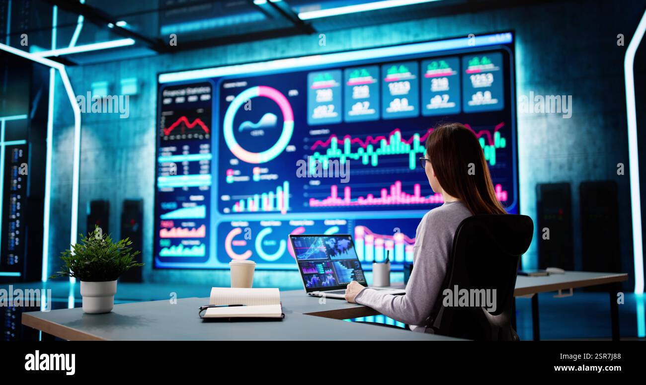 Businessman analyzing market data on desktop dashboard for financial plan. Stock Photo
