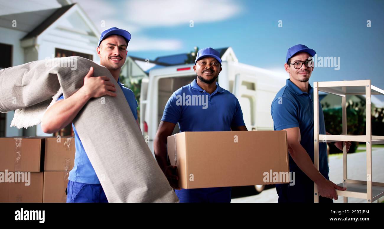 Movers busy unloading furniture and carpet from truck. Office relocation. Furniture decorator. Stock Photo