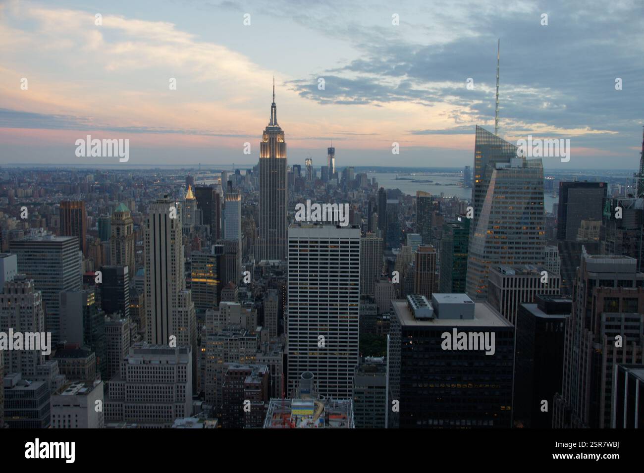 A fiery orange sky bathes the Manhattan skyline in New York City at ...