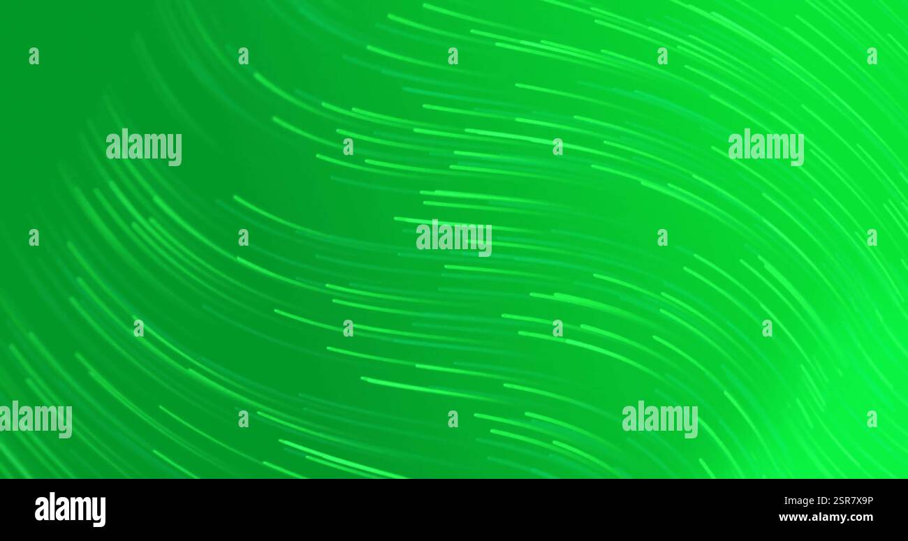 Image of glowing light trails over green background Stock Photo - Alamy