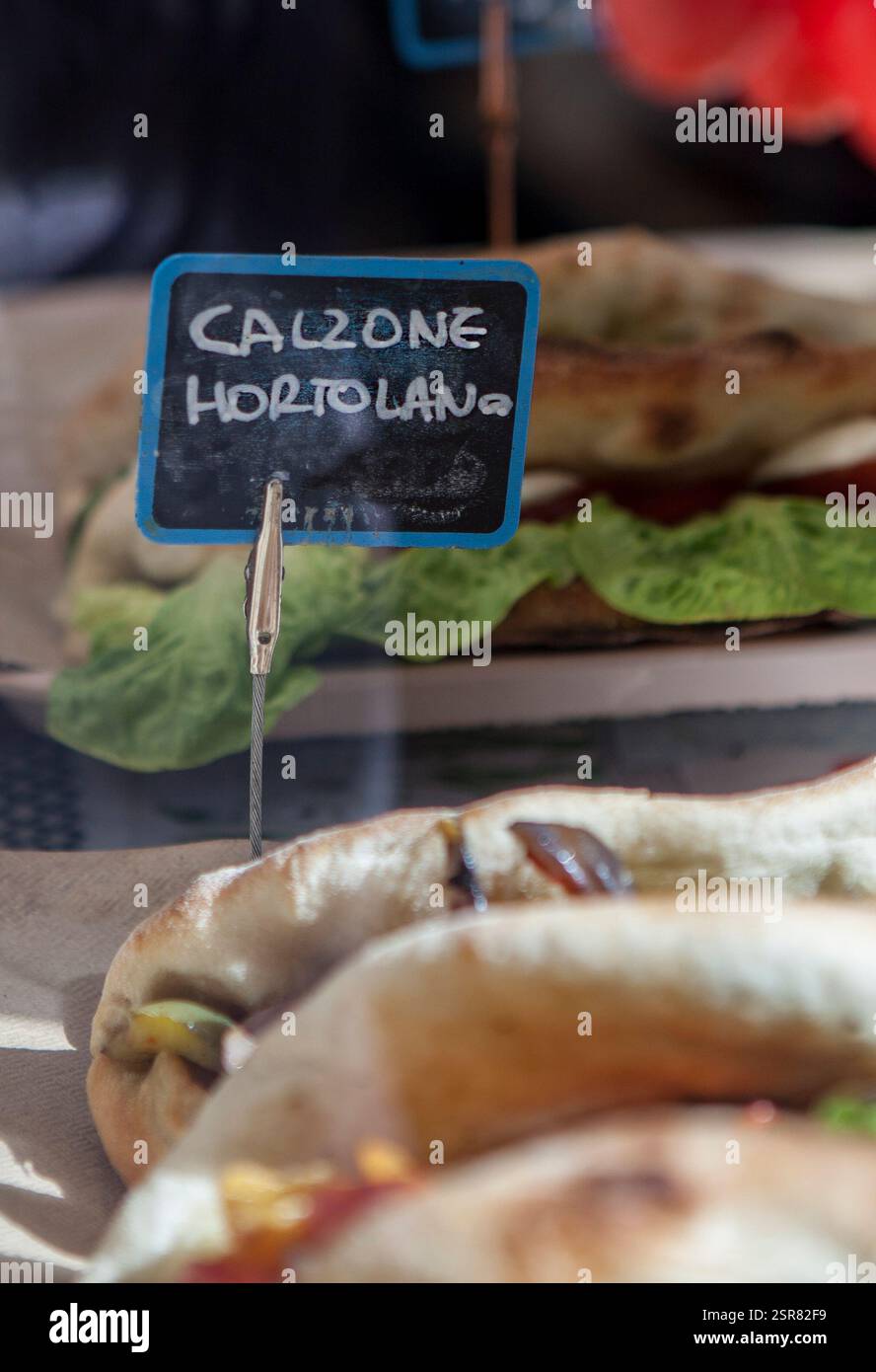 Calzone ortolano slate label holder displayed at trattoria shop window ...