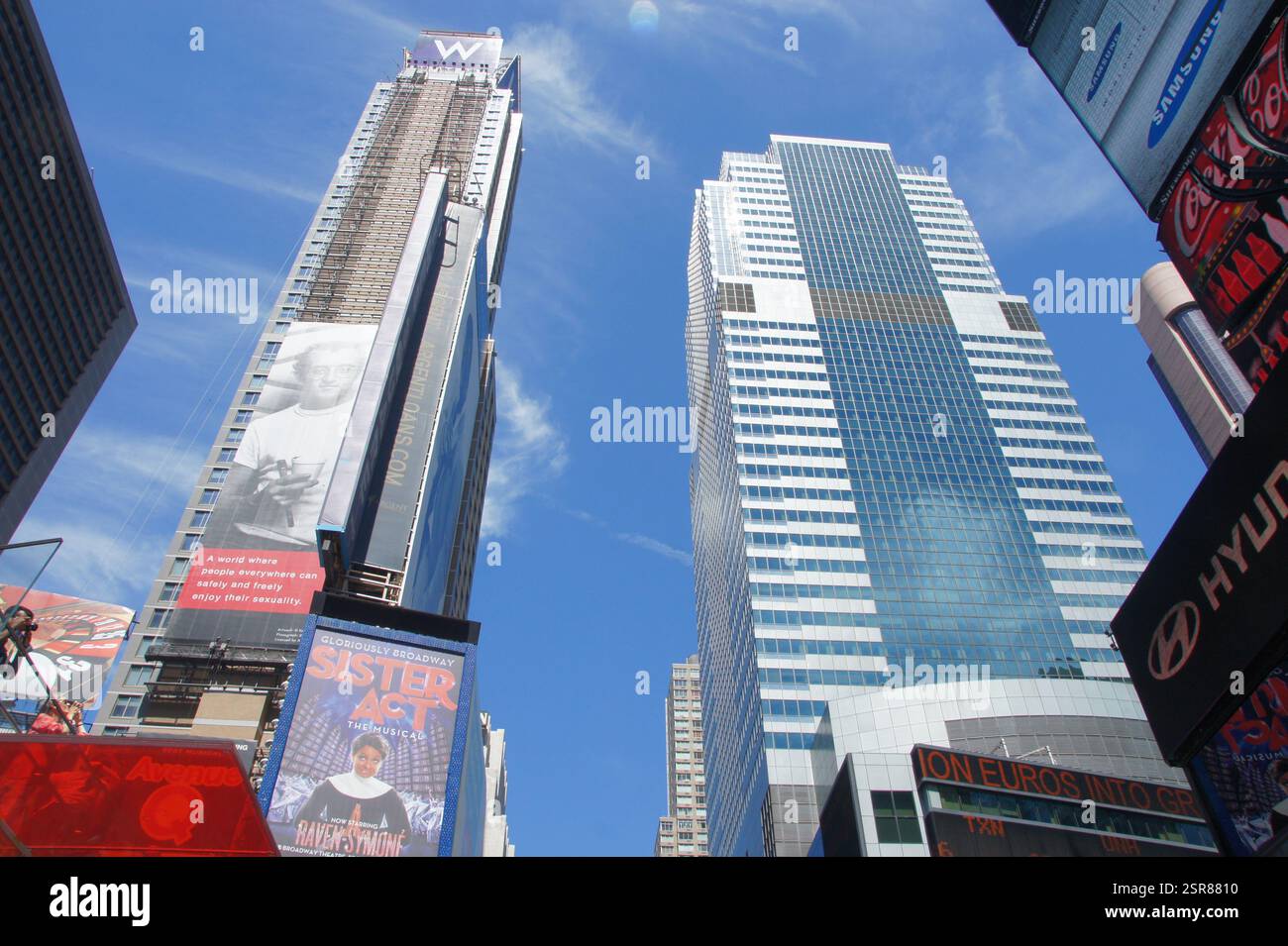Times Square With Towering Skyscrapers Reference: Bustling New York Manhattan A Vibrant Intersection In Times Square