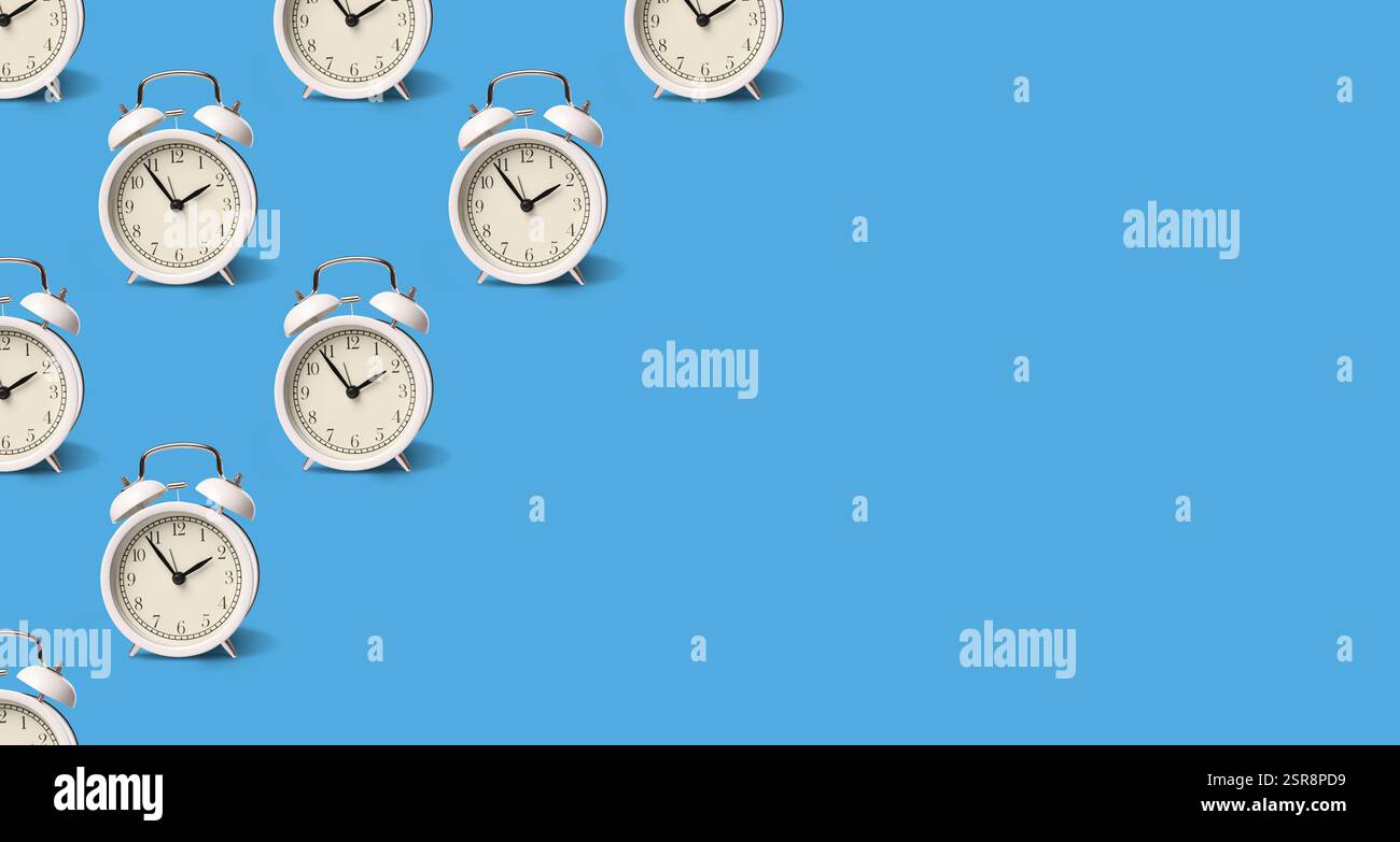 White alarm clocks on pale blue background, pattern. Banner design with space for text Stock Photo