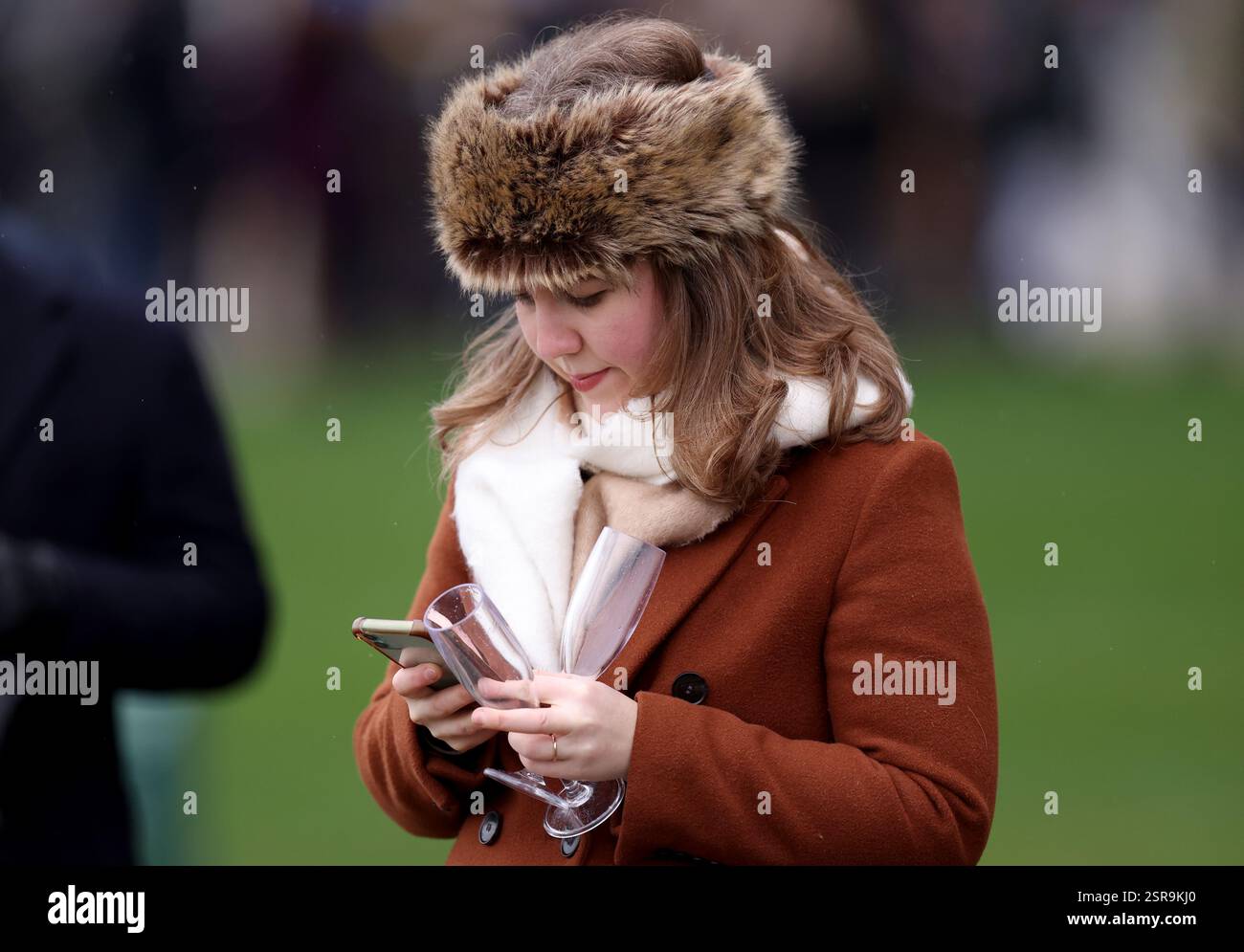 A racegoer attends the Betfair Ascot Chase Raceday at Ascot Racecourse ...
