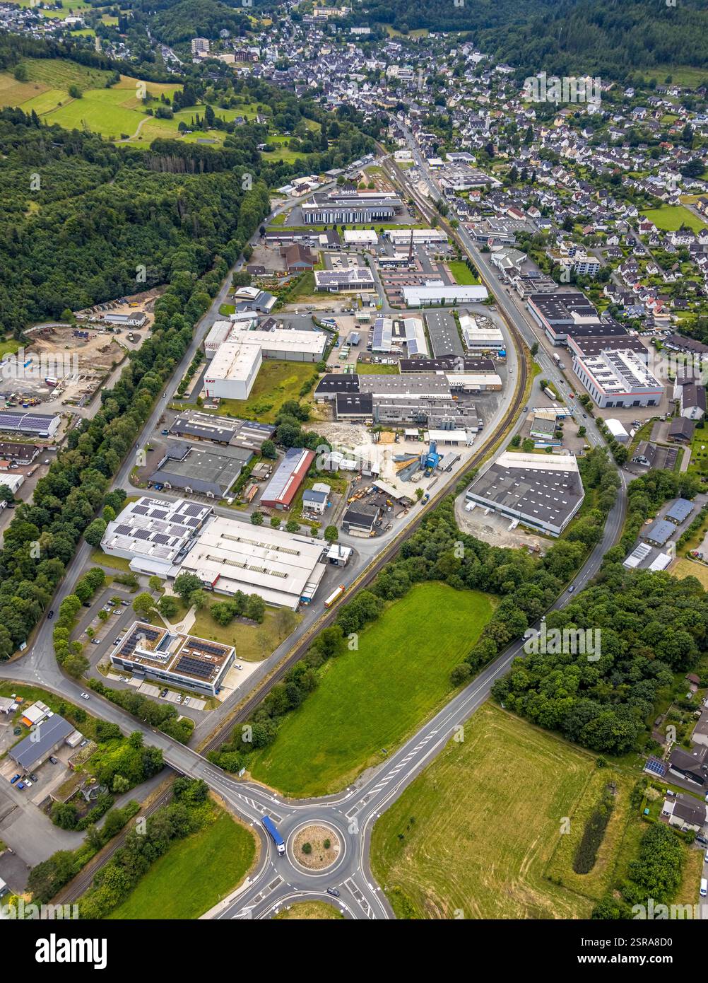 Aerial view, industrial estate in der Aue, traffic circle Bahnhofstraße Bundesstraße, B62, residential area around Thüringer Weg and Hirtsgrunder Weg, Stock Photo