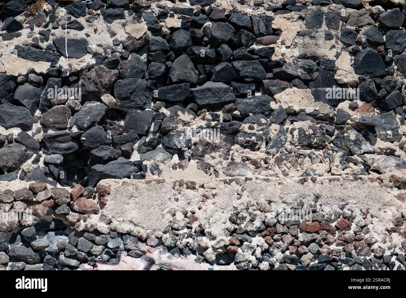 Texture of the black volcanic stones Stock Photo