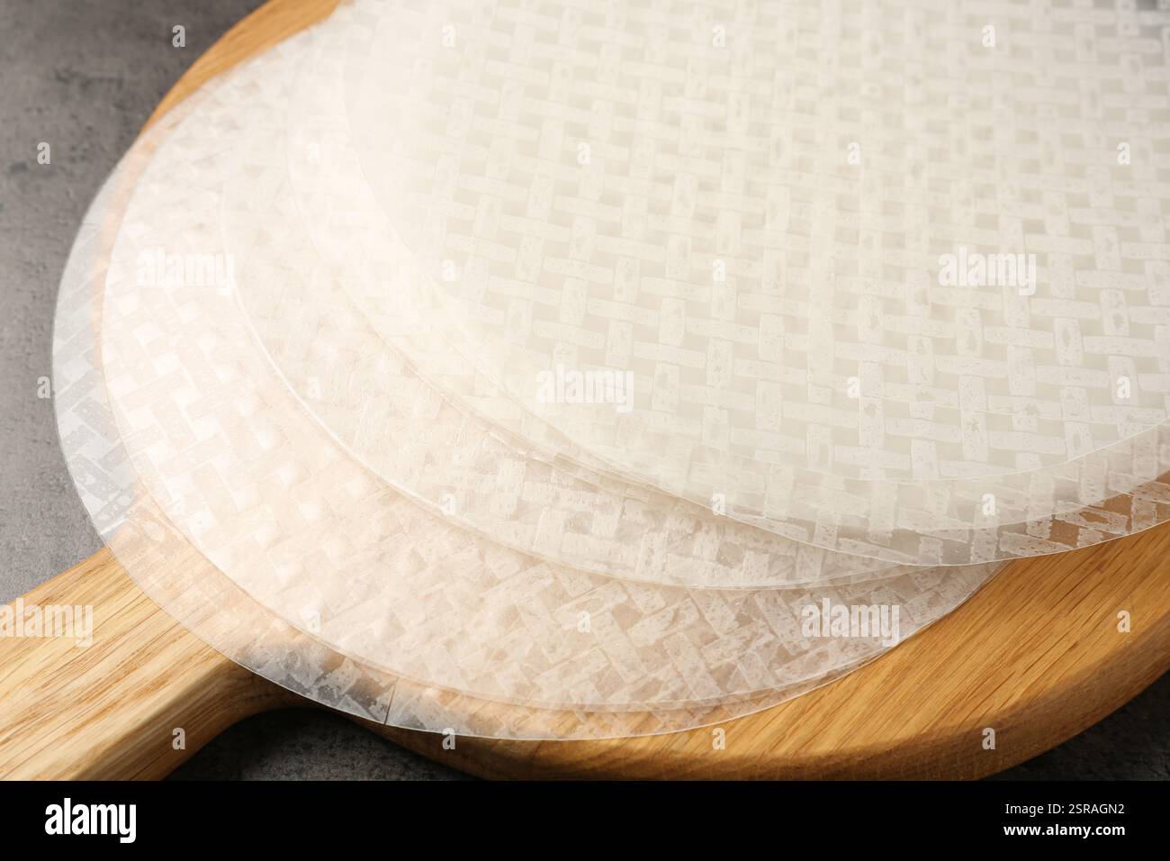 Edible rice paper sheets on grey textured table, closeup Stock Photo ...