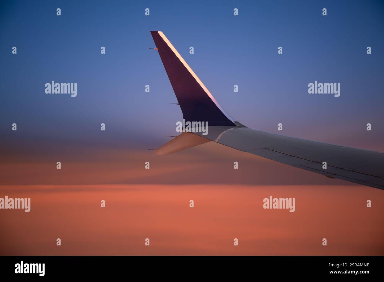 Airplane wing in sunset flight hi-res stock photography and images - Alamy
