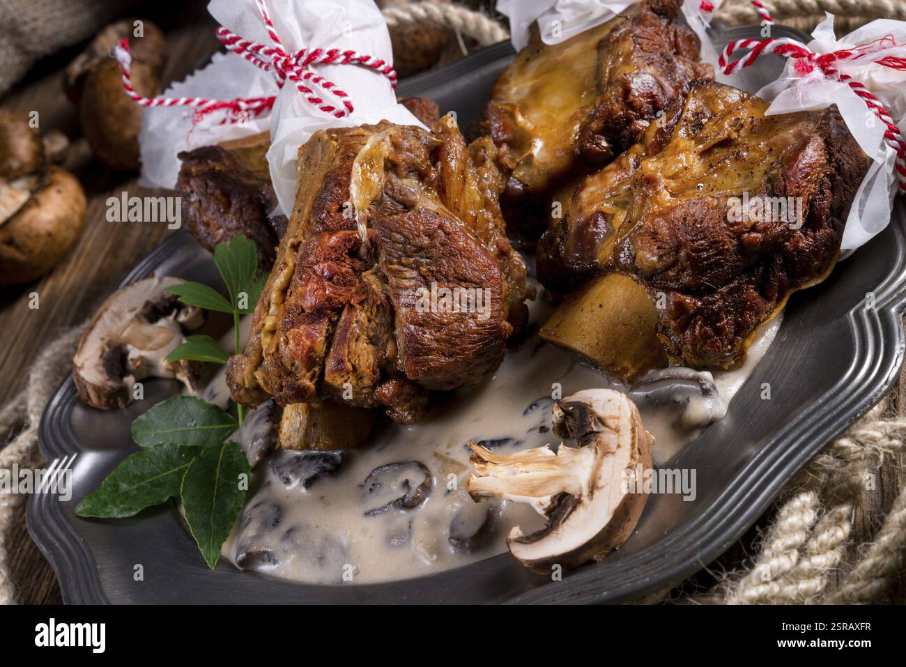 Grilled rinderrippchen with mushroom sauce Stock Photo - Alamy