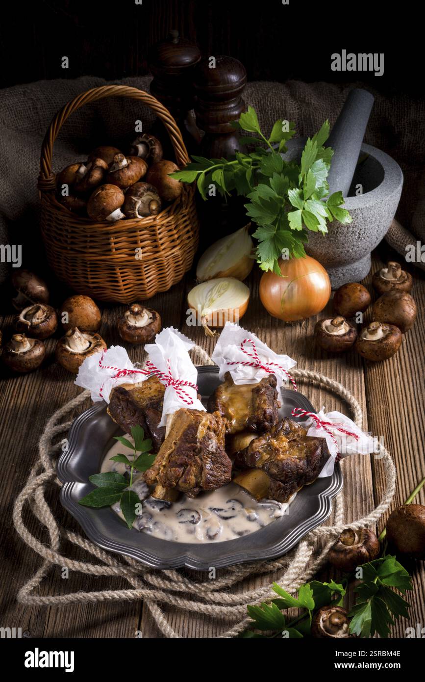 Grilled rinderrippchen with mushroom sauce Stock Photo - Alamy