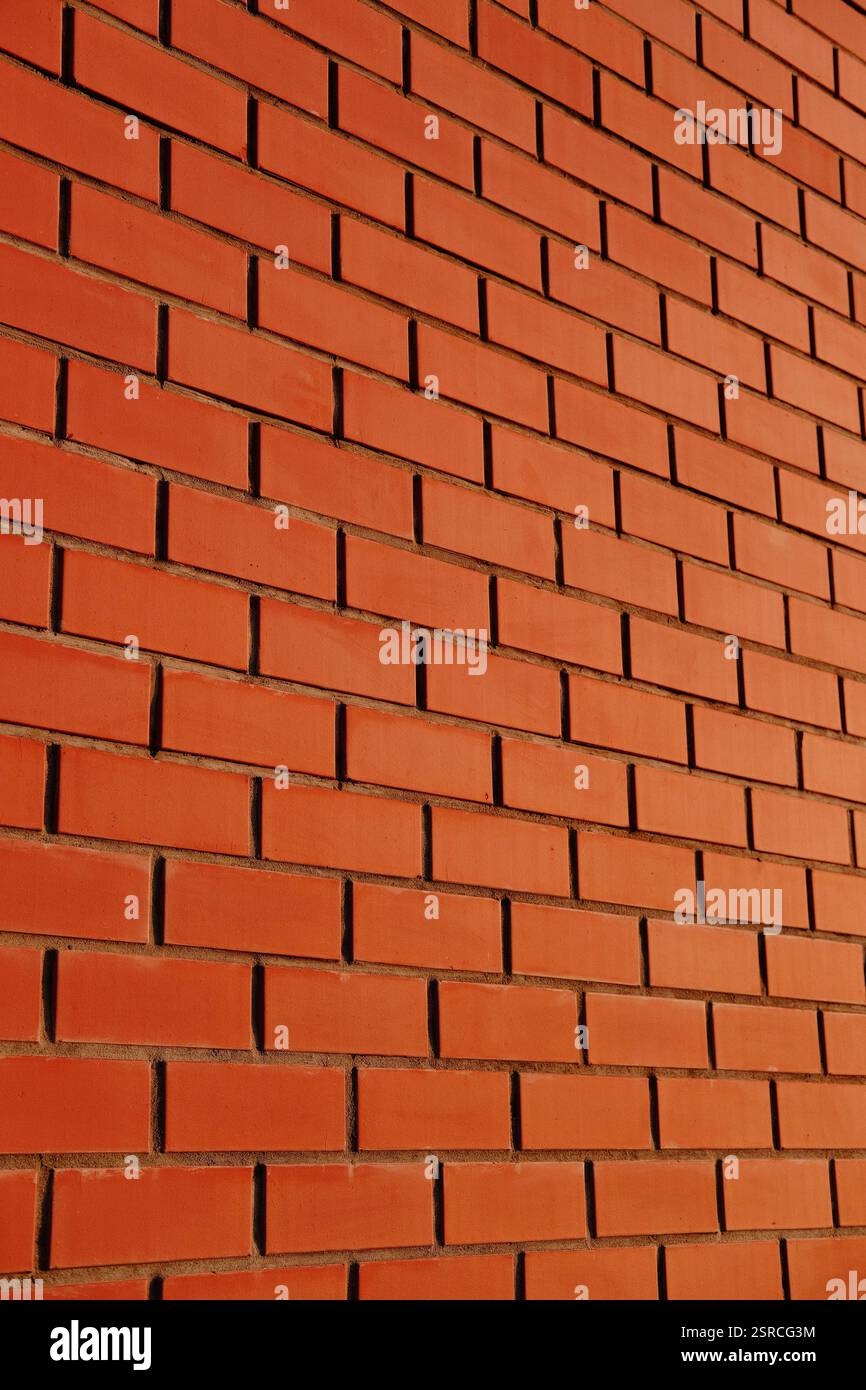 Red brick wall in perspective. Masonry brickwork background. Abstract backdrop. Stock Photo