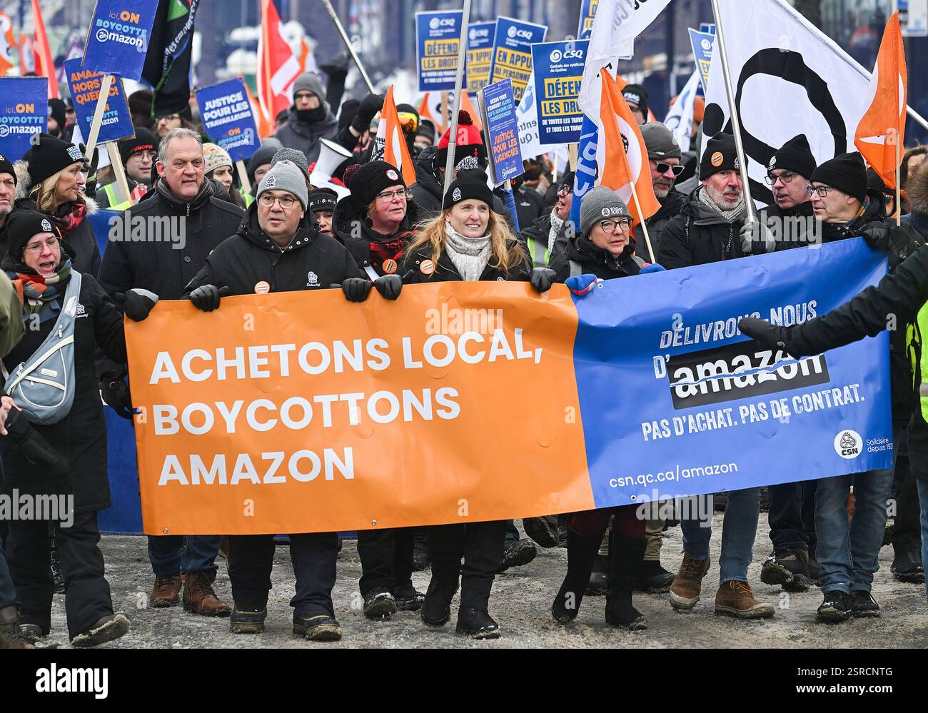 People take part in a protest in Montreal, Saturday, Feb. 15, 2025 ...