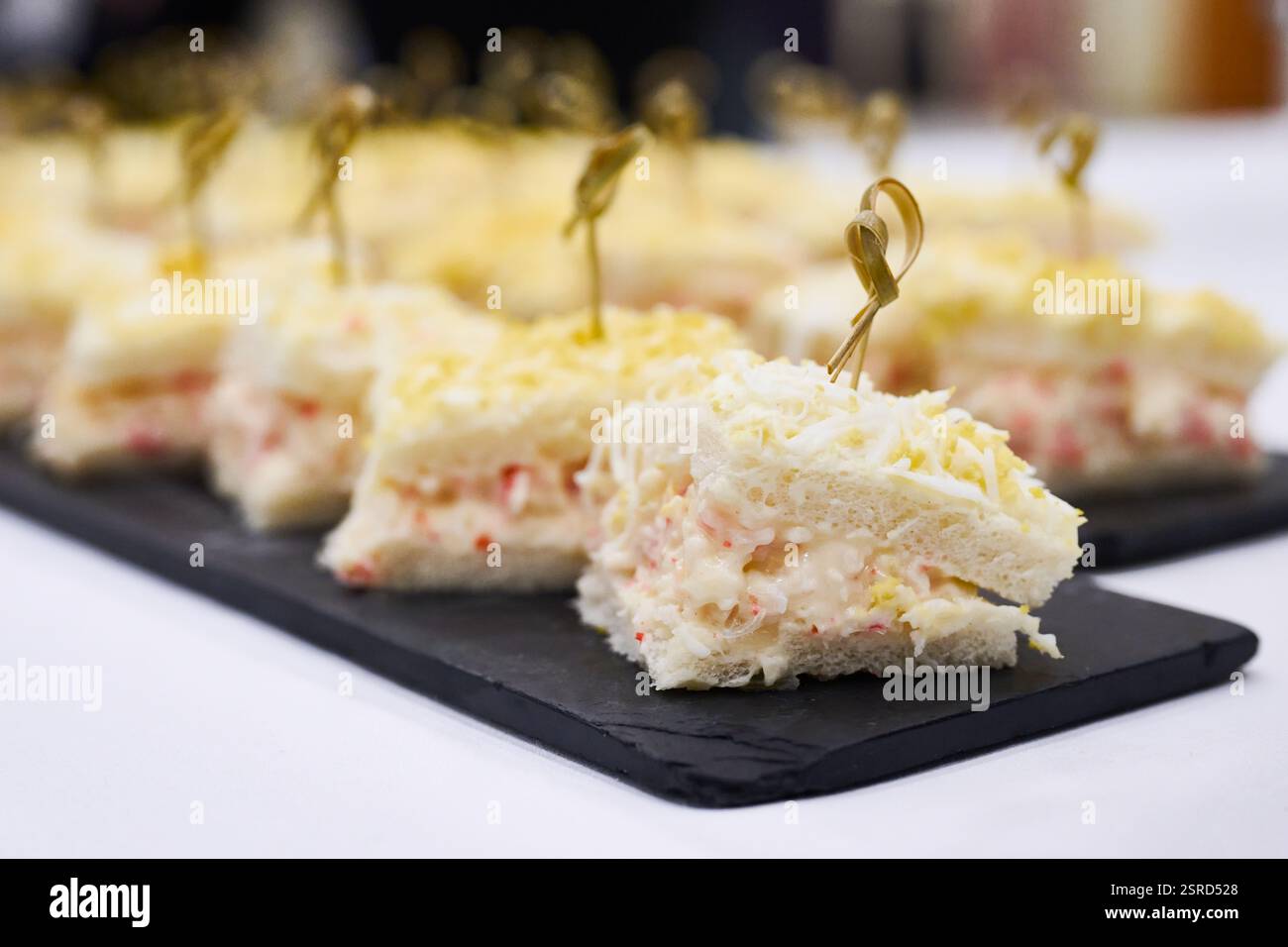 Chaca Mini Mini chaca sandwiches with boiled egg and mayonnaise on a slate base ...