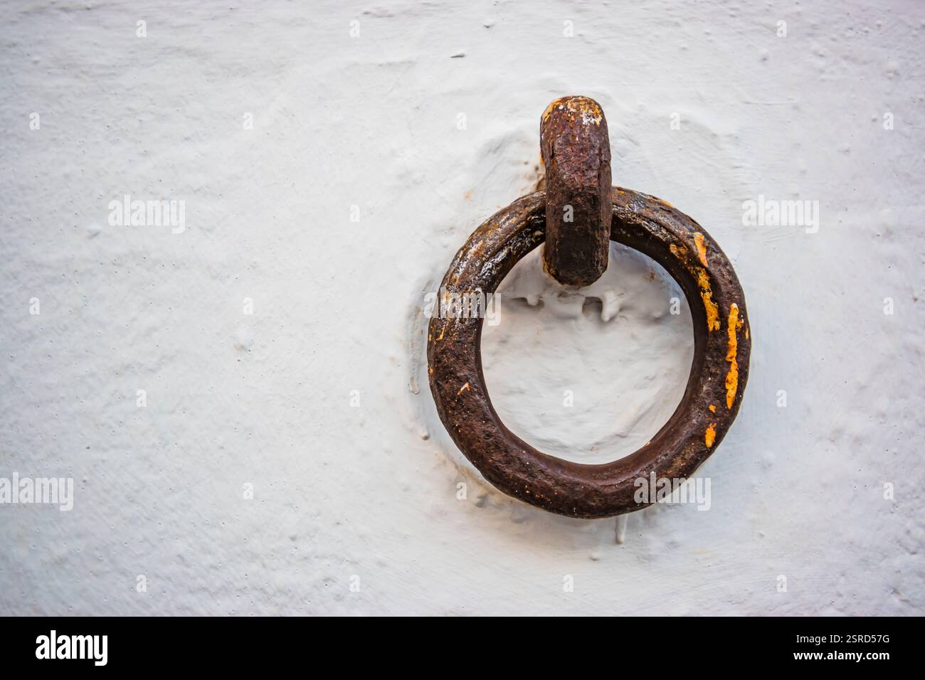 Fixed knocker on the wall to tie a cavalry to it. Malága, Andalucia, Spain, Europe. Stock Photo