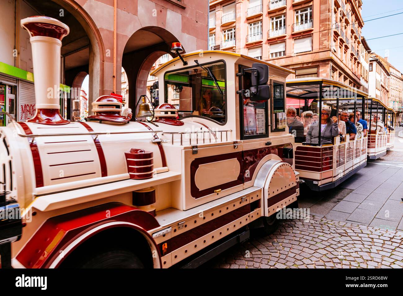 Small tourist train on the city streets. Strasbourg, Bas-Rhin, Grand Est, France, Europe Stock Photo