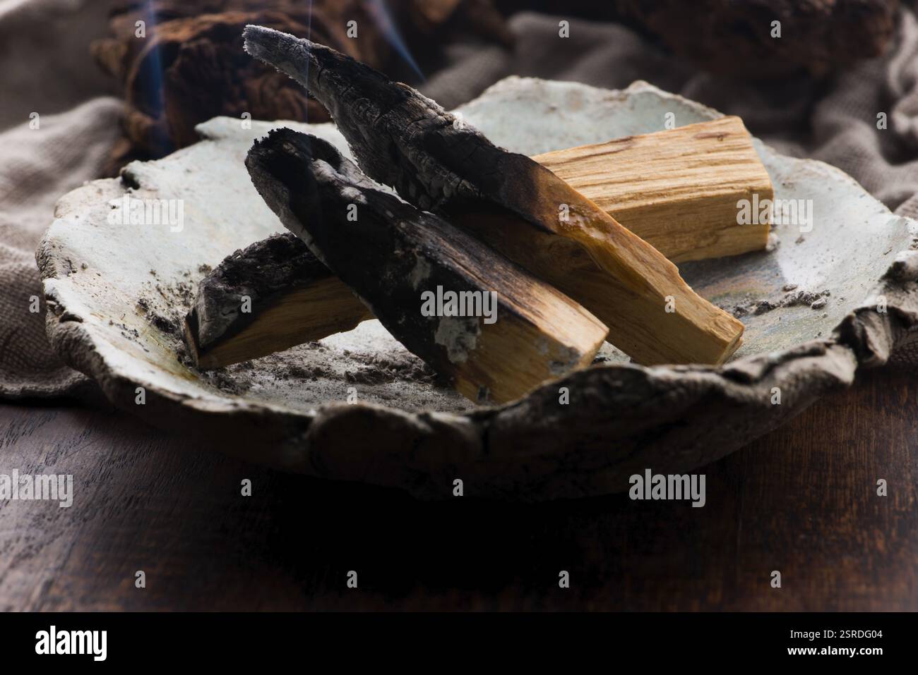 Smudging ceremony using Peruvian Palo Santo holy wood incense stick Stock Photo
