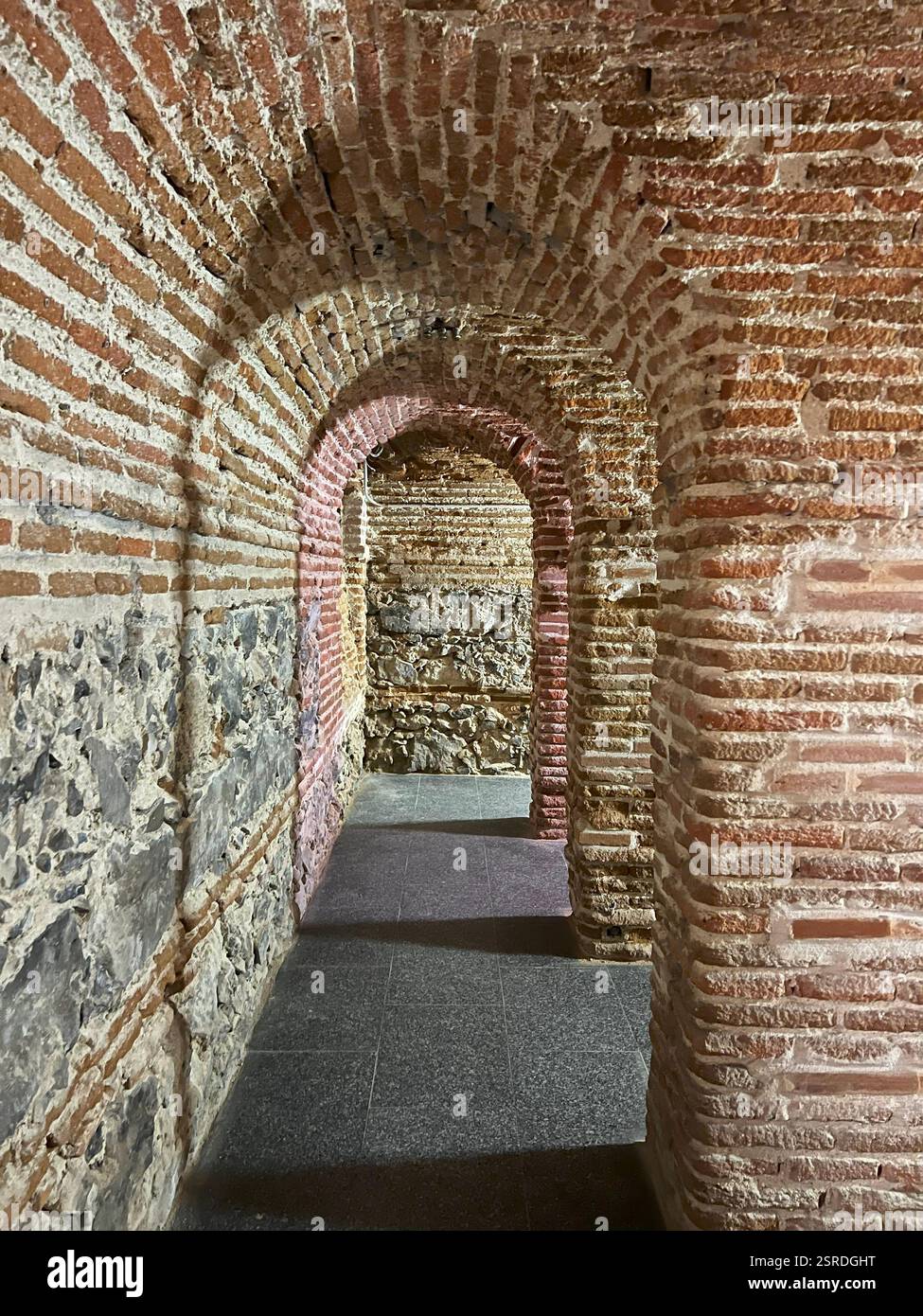 Historic hallway with brick arches - Smartphone Captured Stock Image