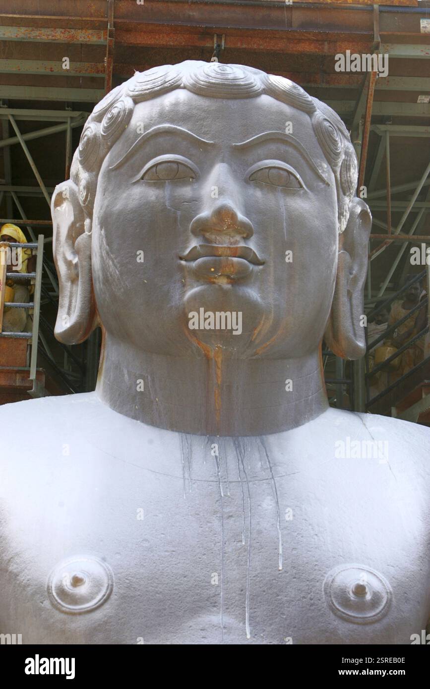 Sandalwood powder sprinkled on eighteen meter high statue of bhagwan ...