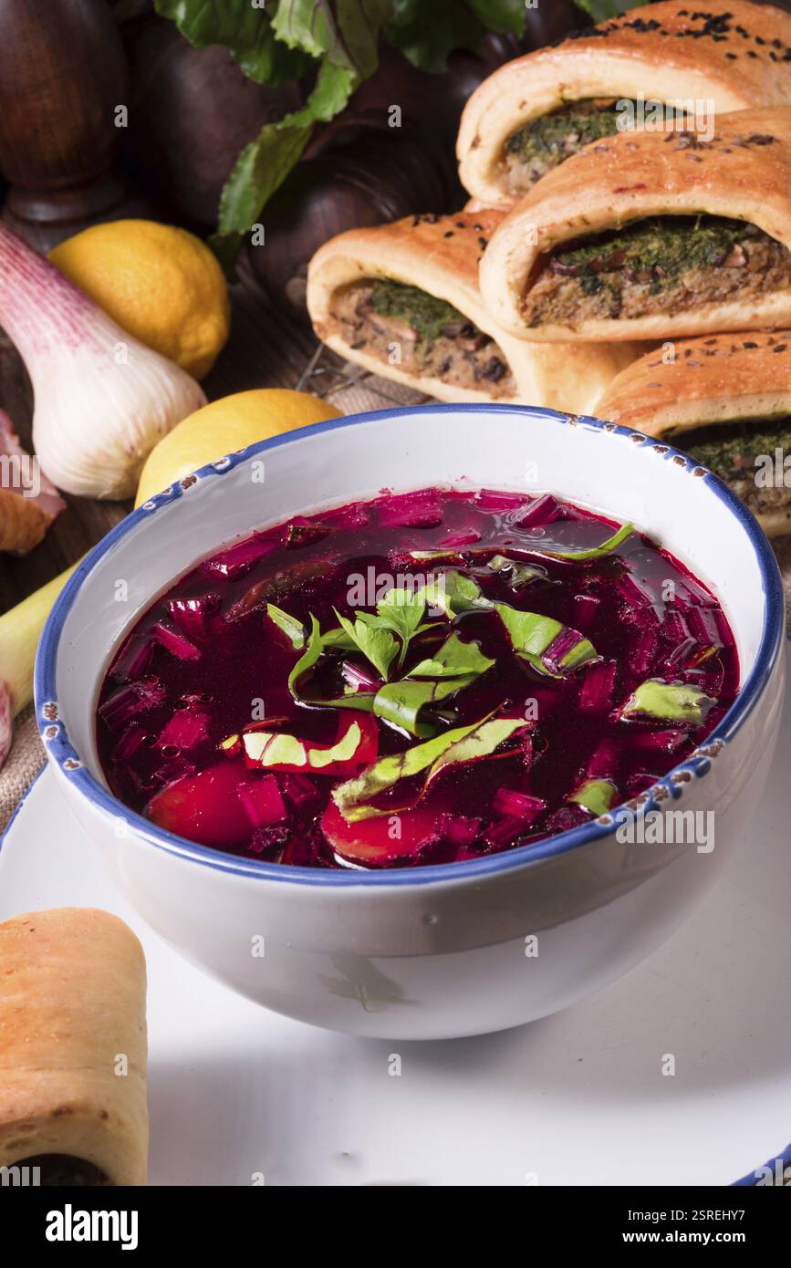 Beet green soup with pastries Stock Photo