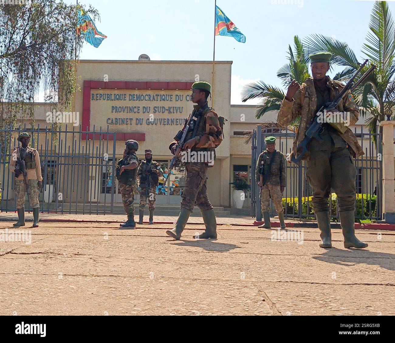 M23 rebels guard outside the South Kivu province administrative office