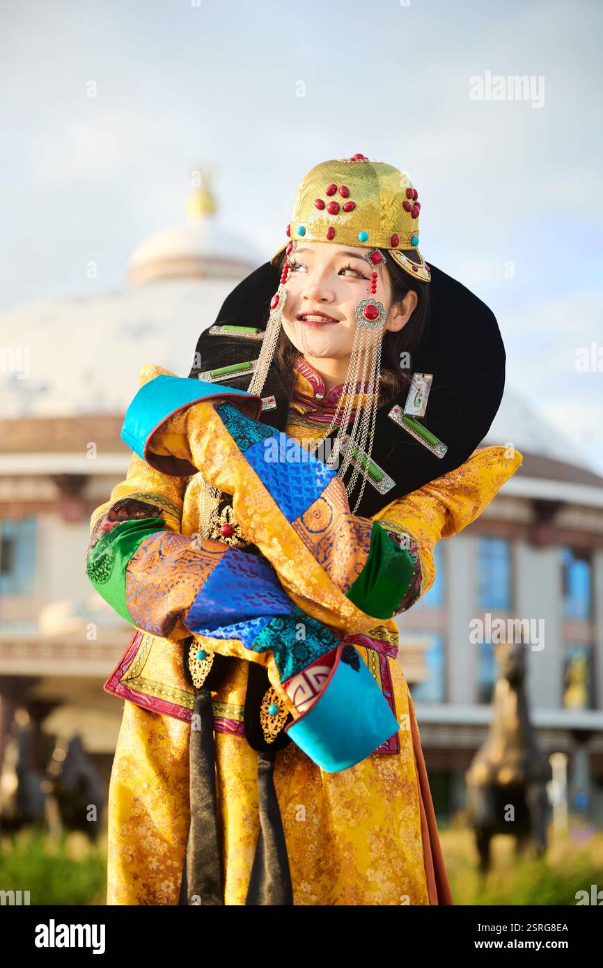 Mongolian girl wearing traditional costume of the Mongolian Ordos tribe ...