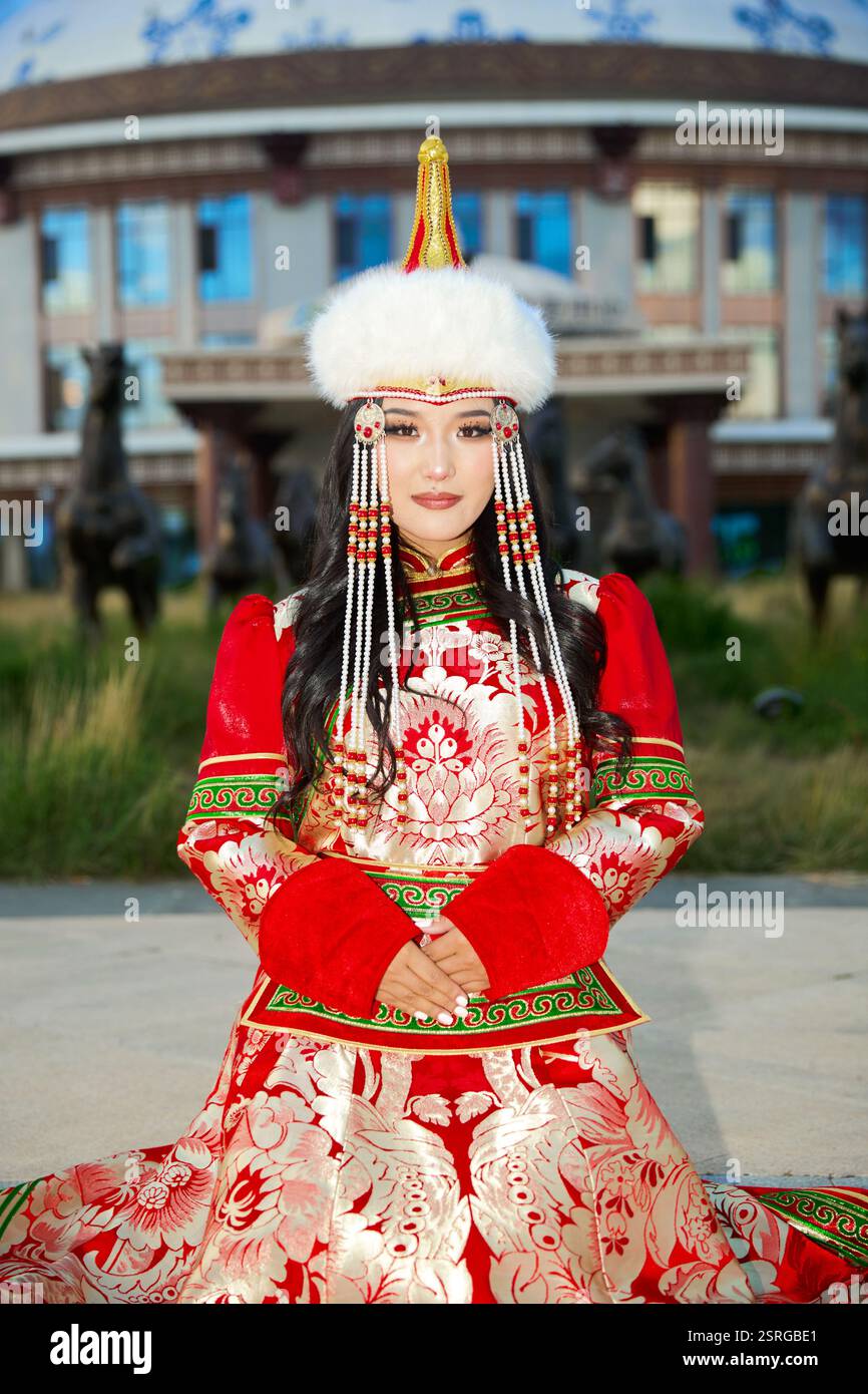 Mongolian girl wearing traditional costume of the Mongolian Ordos tribe ...